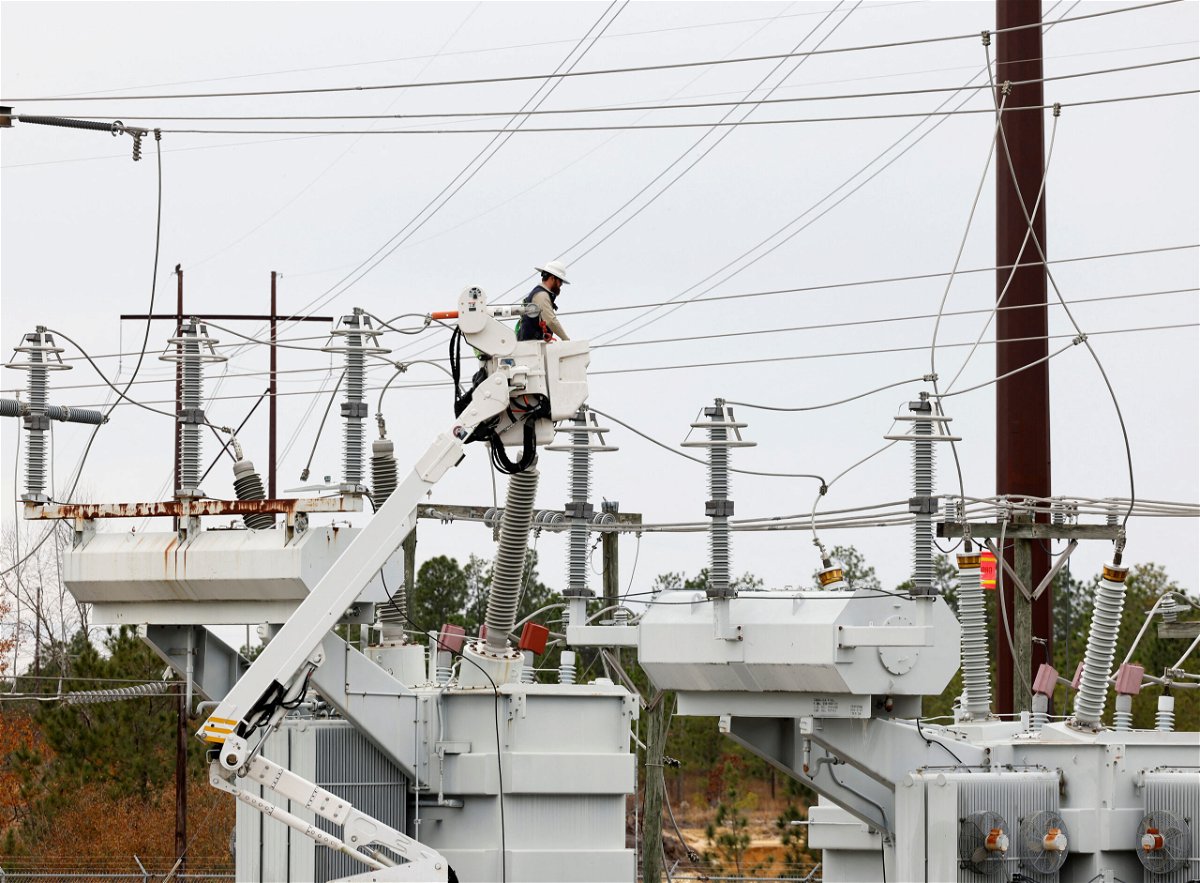 <i>Jonathan Drake/Reuters</i><br/>Duke Energy personnel work to restore power at a second crippled electrical substation after the Moore County Sheriff said that vandalism caused a mass power outage