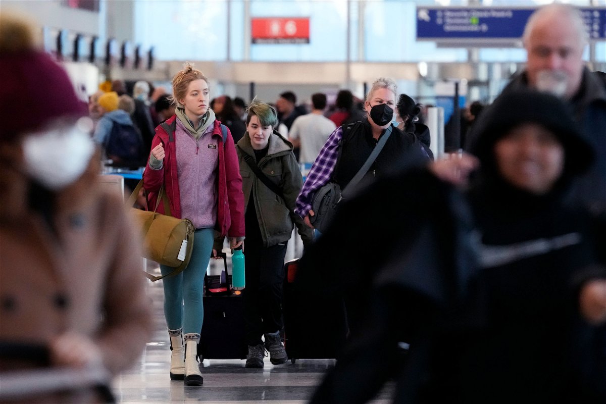 <i>Nam Y. Huh/AP</i><br/>Travelers walk through Terminal 3 at O'Hare International Airport in Chicago.
