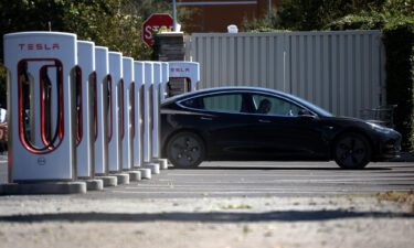 A Tesla car sits parked at a Tesla Supercharger in September 2020 in Petaluma