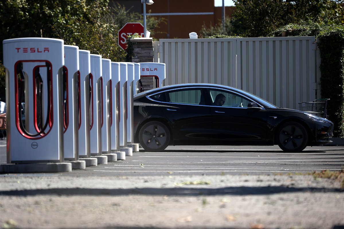 <i>Justin Sullivan/Getty Images</i><br/>A Tesla car sits parked at a Tesla Supercharger in September 2020 in Petaluma