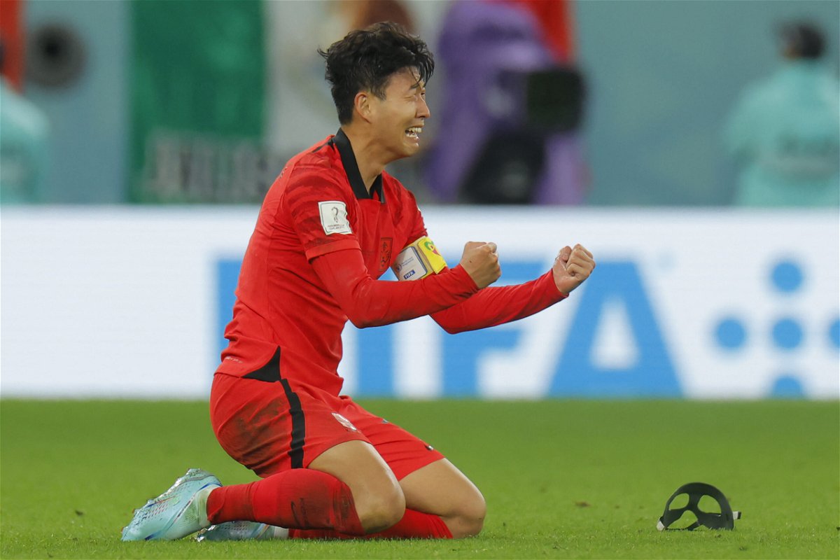 <i>Odd Andersen/AFP via Getty Images</i><br/>Son Heung-min celebrates victory over Portugal.
