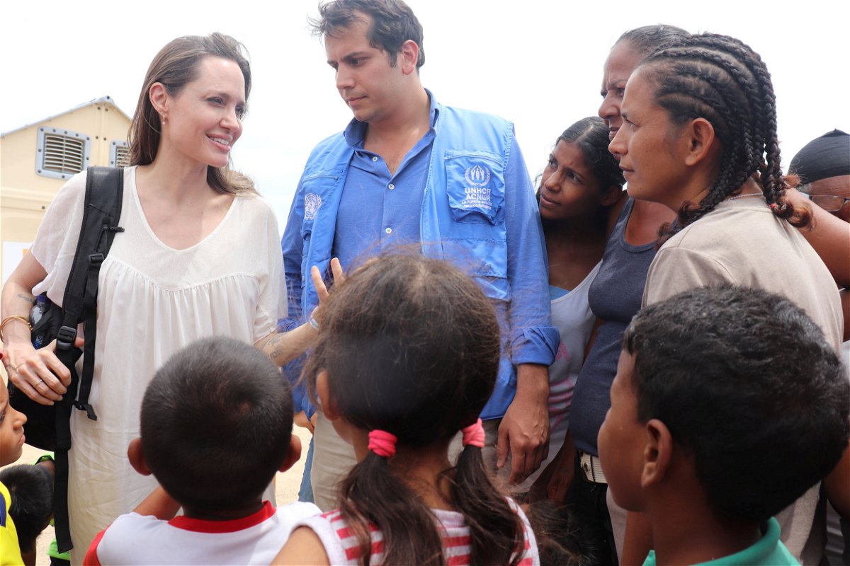 <i>Colombian Foreign Ministry/Handout/Reuters</i><br/>Special envoy Angelina Jolie talks to people inside a camp run by the UN Refugee Agency