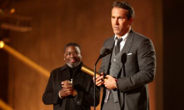 Lil Rel Howery presents The People's Icon award to honoree Ryan Reynolds on Tuesday.