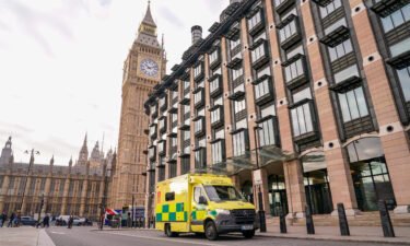 An ambulance is parked outside Portcullis House in London