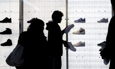 People shop for shoes in a Nike store on Black Friday on November 25 in New York.