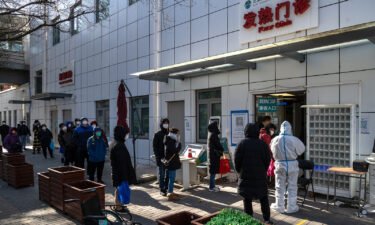 China's Covid surge has sparked panic buying of some medications and even canned peaches. Residents line up at a fever clinic in Beijing