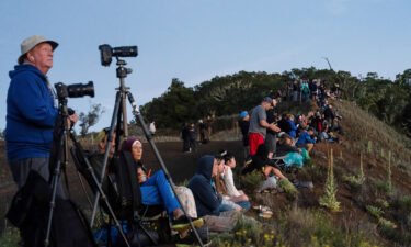 People gather to observe the eruption of Mauna Loa on December 1.