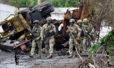 Russian servicemen patrol the destroyed part of the Ilyich Iron and Steel Works in Ukraine's port city of Mariupol on May 18