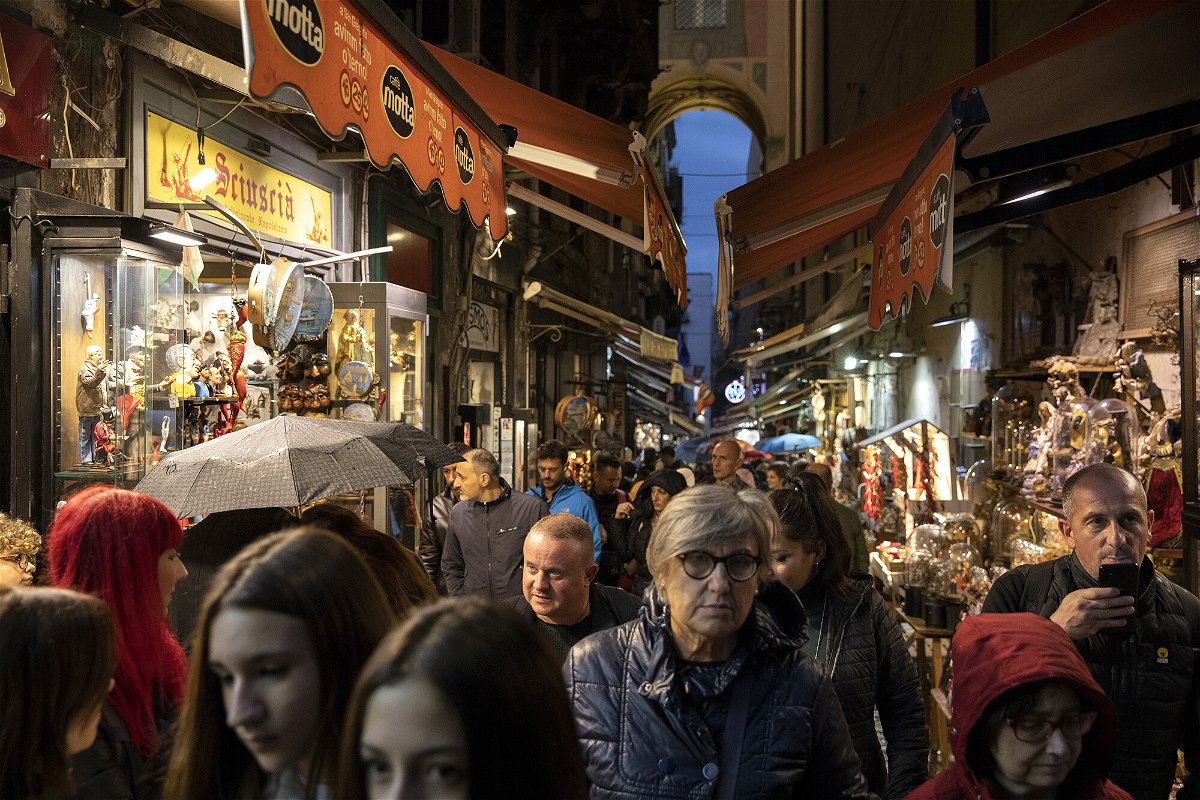 <i>Anadolu Agency/Getty Images</i><br/>Italy implements one-way foot traffic in 'dangerously' overtouristed street. People walk in a touristic area in Naples