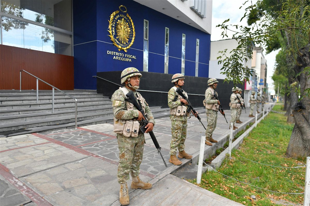 <i>Diego Ramos/AFP/Getty Images</i><br/>The military stand guard at an official building after demonstrations turned violent.