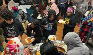Families line up for food at Spirit Of Truth Urban Ministry in Buffalo