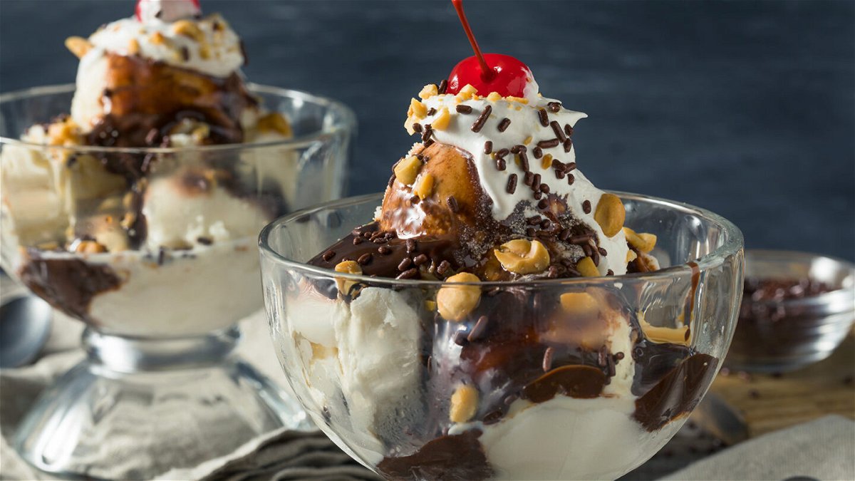 <i>Brent Hofacker/Adobe Stock</i><br/>Dress up an ice cream sundae with toppings such as chocolate sauce