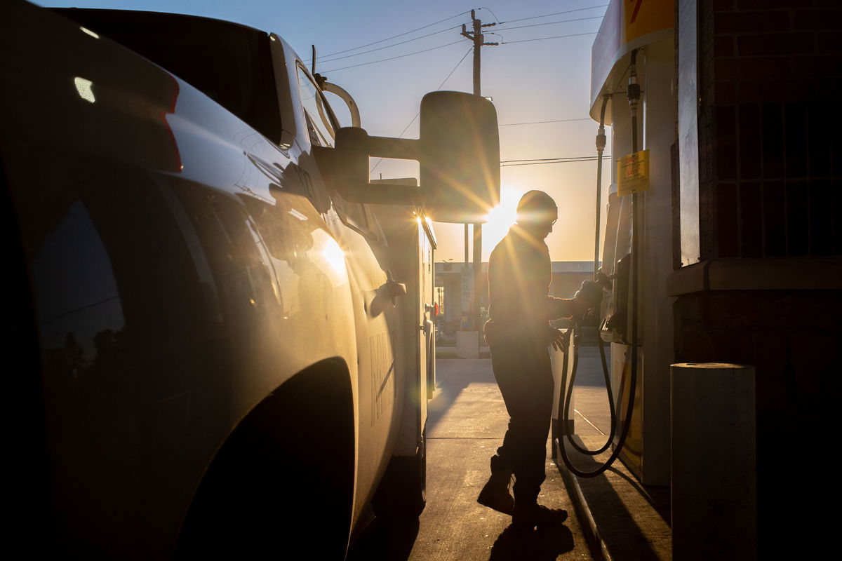 <i>Brandon Bell/Getty Images</i><br/>A person finishes pumping gas at a Shell gas station on April 01