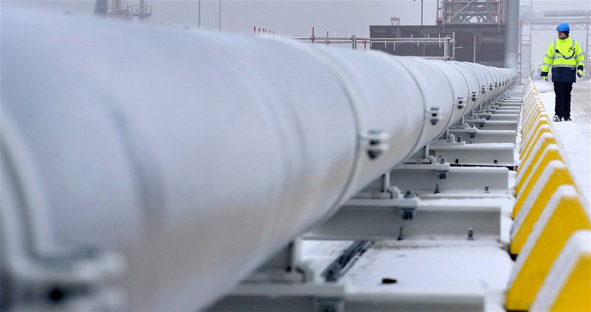 <i>Michael Sohn/Pool/AFP/Getty Images</i><br/>A worker walks past gas pipes in Wilhelmshaven