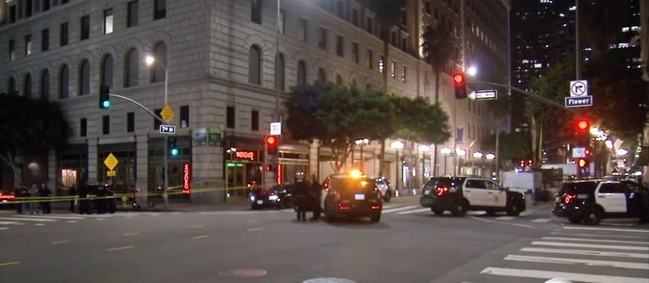 <i></i><br/>A person of interest in the shooting and stabbing of a teenager in downtown Los Angeles managed to slip away from police custody while in handcuffs