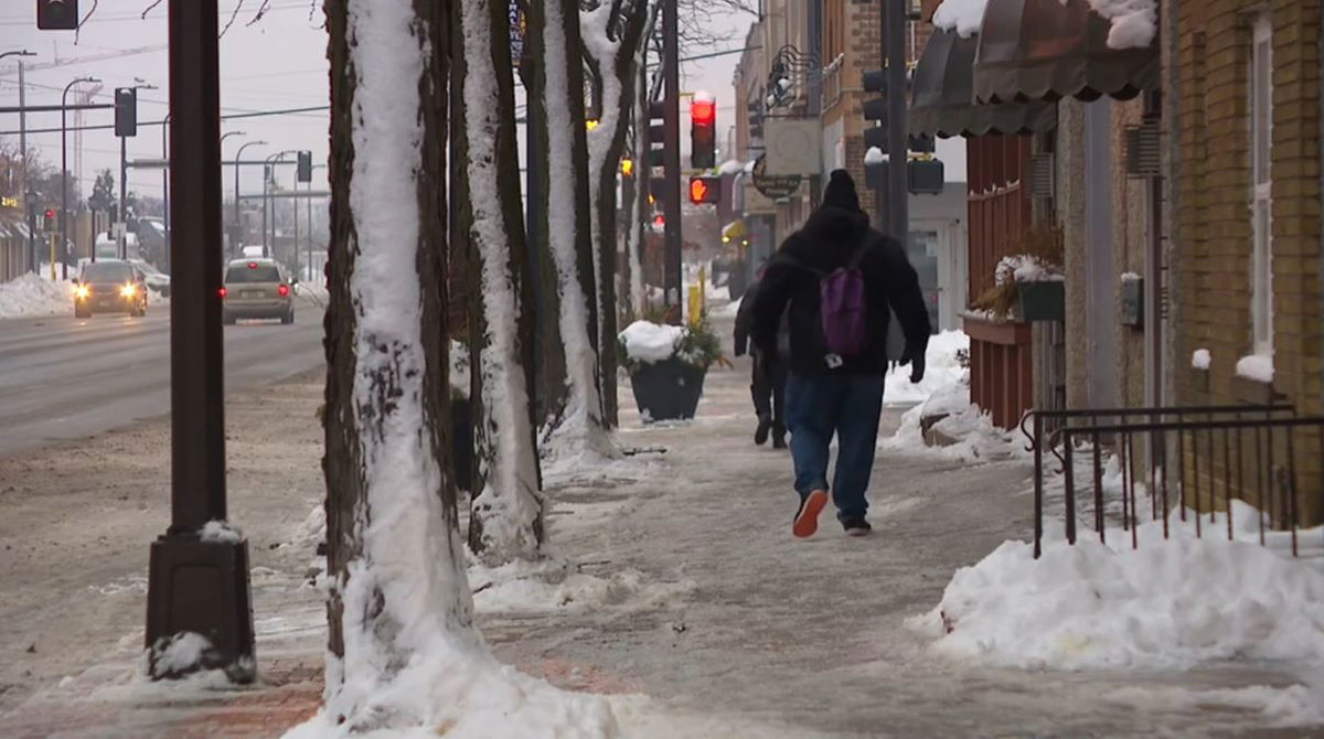 <i></i><br/>Minneapolis residents battle against - and penguin-walk across - icy surfaces.