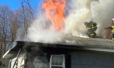 Norwalk Fire responded to a house fire at 11:59pm on January 8. Firefighters are shown on the roof of the house.