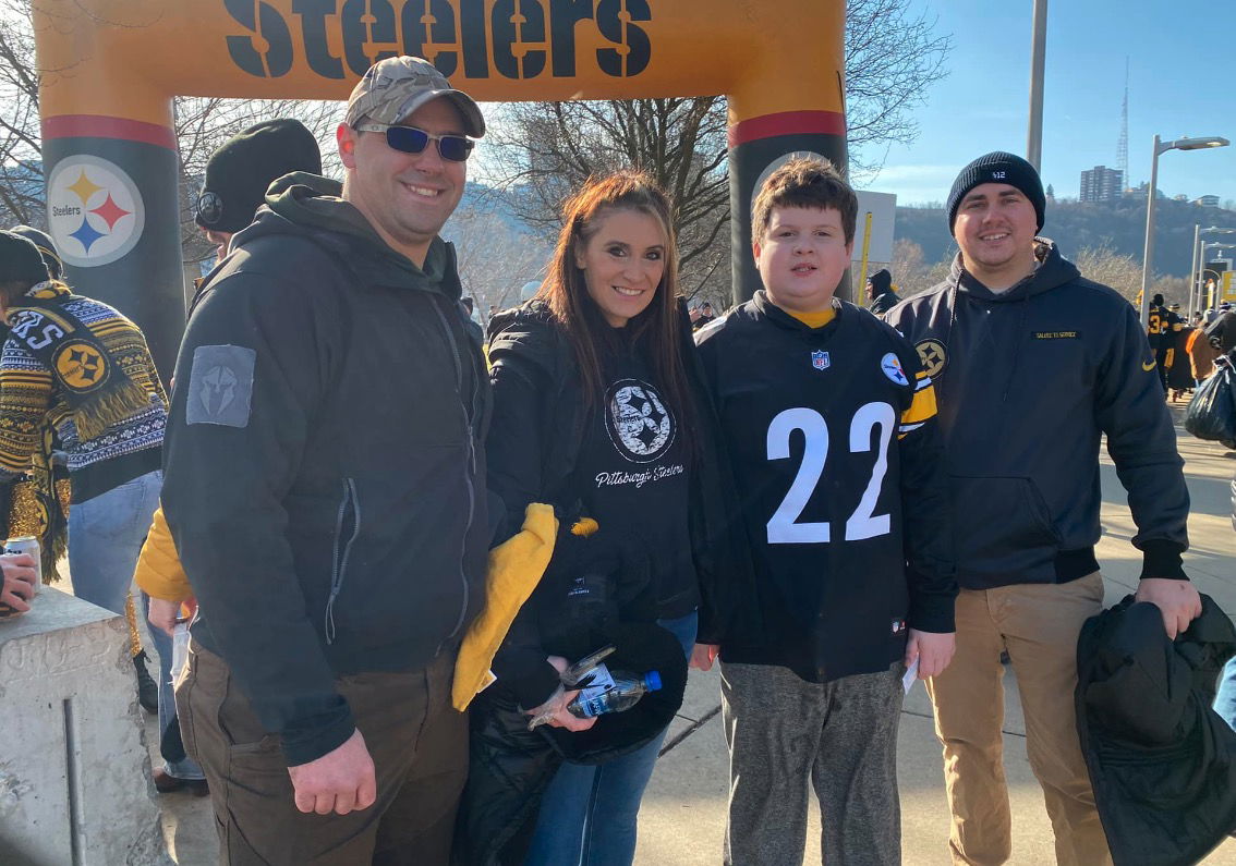 <i>Pittsburgh Bureau of Police/Facebook</i><br/>A boy got to watch the Steelers game while wearing a signed Najee Harris jersey after police said a burglar stole his Christmas gifts.