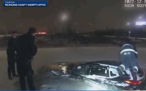 <i>Milwaukee County Sheriff's Office</i><br/>New body camera footage from a snowstorm in December shows first responders acting quickly to save a woman from a car partially submerged in a pond.