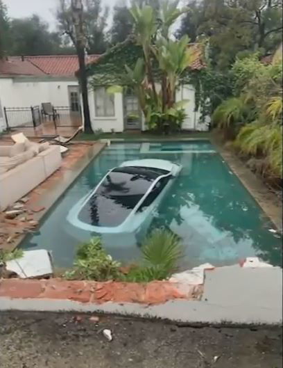 <i>Pasadena Fire Department/KABC</i><br/>A Tesla driver in Pasadena drove through a wall and landed in a pool on January 10