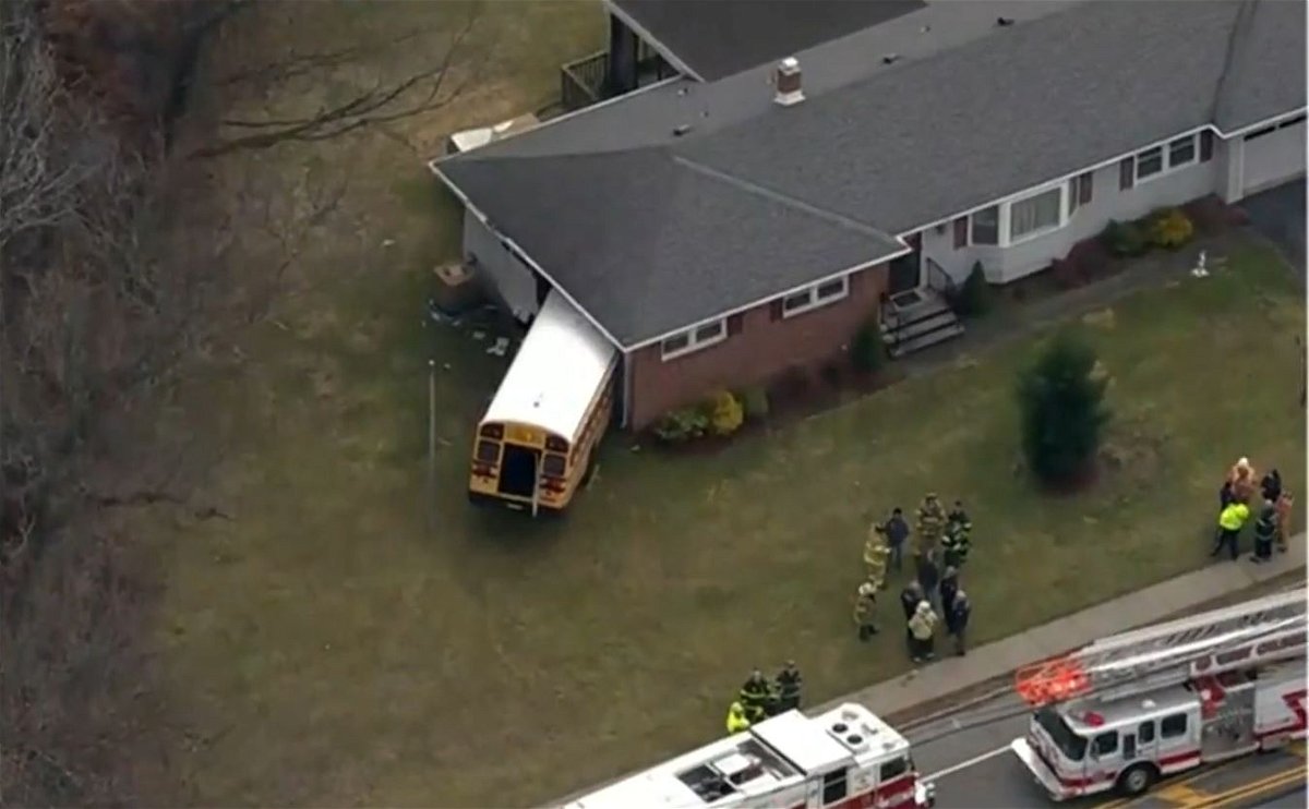<i>WCBS</i><br/>Neighbors watched in horror as the big yellow bus careened into the house.