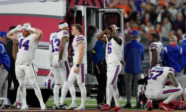 Buffalo Bills players react as teammate Damar Hamlin is examined during the first half of an NFL football game against the Cincinnati Bengals