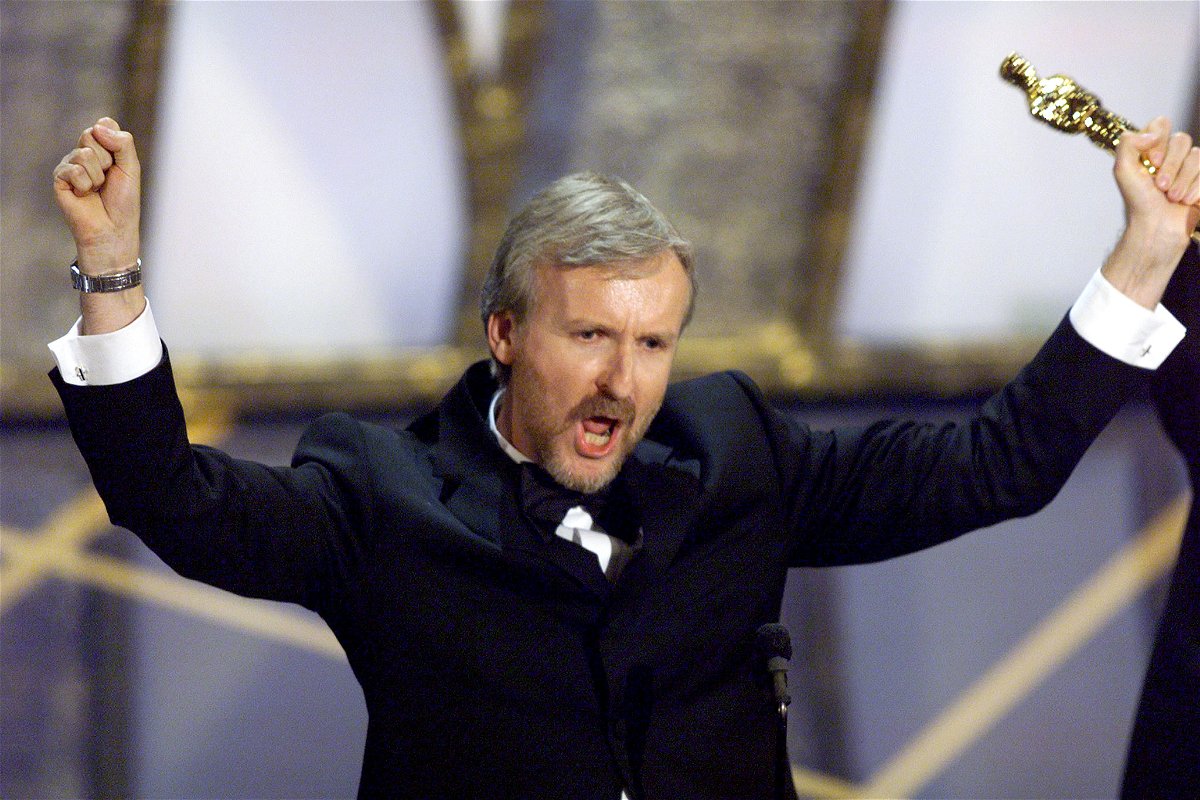 <i>Gary Hershorn/Reuters</i><br/>James Cameron holds up the Oscar he won for best director for the movie 