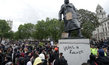 A statue of former British Prime Minister Winston Churchill is seen defaced in Parliament Square