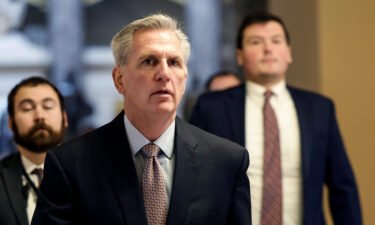 House Speaker Kevin McCarthy (center) walks to open floor of the House Chambers in the US Capitol Building on January 30.