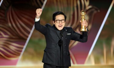 Ke Huy Quan accepts the best supporting actor in a motion picture award for "Everything Everywhere All at Once" onstage at the 80th Annual Golden Globe Awards.