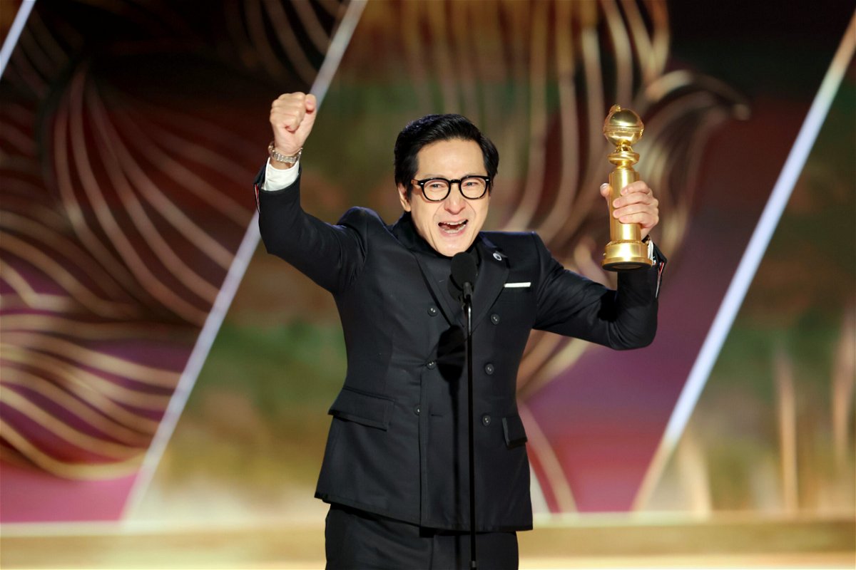 <i>Rich Polk/NBC/Getty Images</i><br/>Ke Huy Quan accepts the best supporting actor in a motion picture award for 