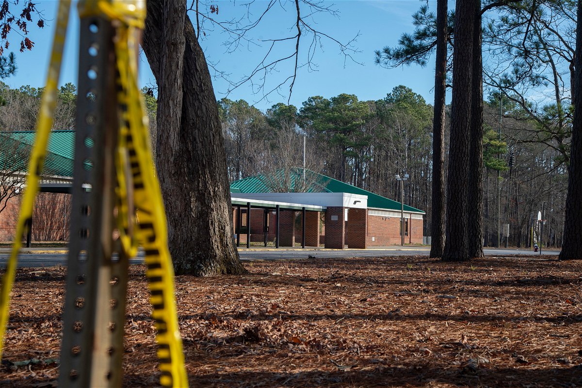 <i>Jay Paul/Getty Images</i><br/>Police tape hangs from a sign post outside Richneck Elementary School following a shooting on January 7
