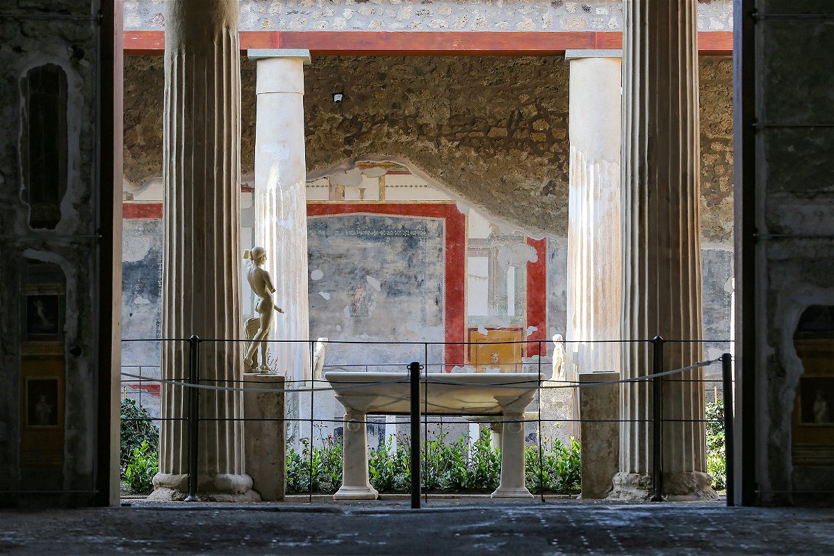<i>Marco Cantile/LightRocket/Getty Images</i><br/>The courtyard of the House of the Vettii with a statue of Priapus
