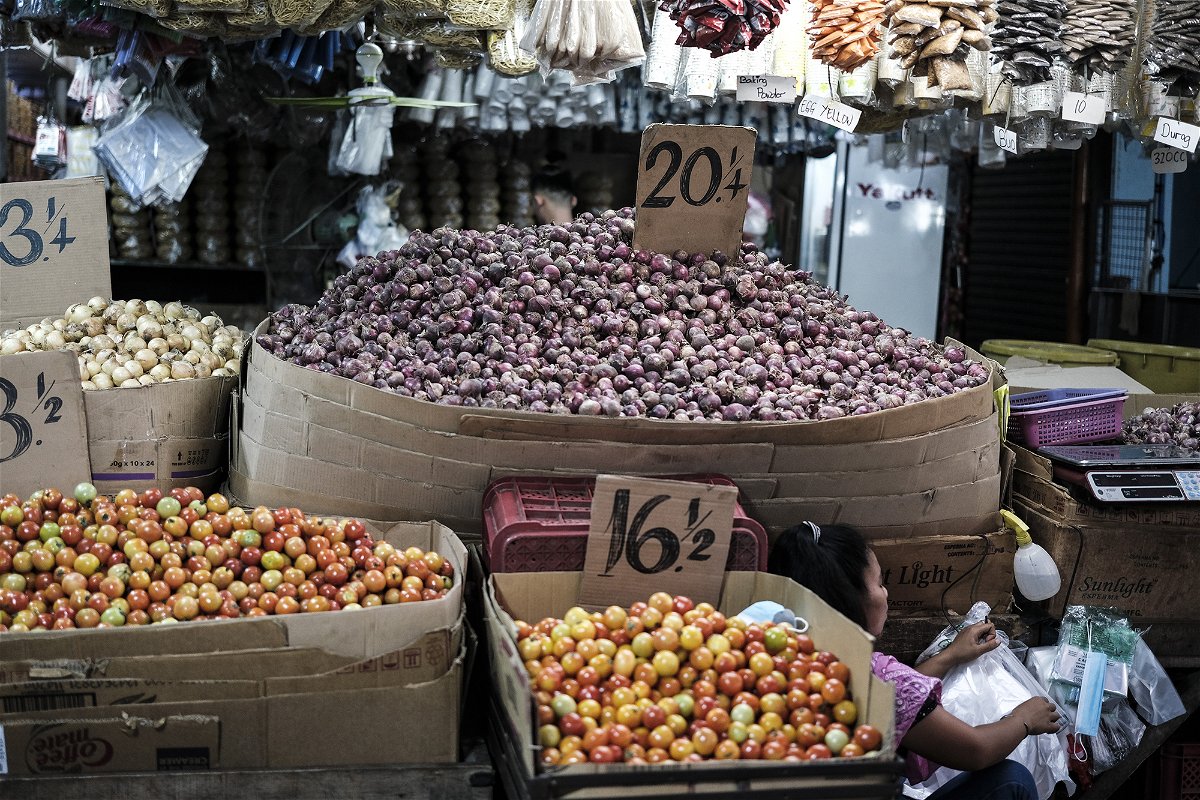 <i>Veejay Villafranca/Bloomberg/Getty Images</i><br/>Onions are so expensive in the Philippines they're being smuggled into the country. A stall selling vegetables and spices in a market in Tarlac City