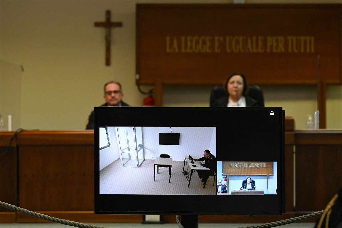 <i>Miguel Medina/AFP/Getty Images</i><br/>A television screen in a special bunker court in Caltanissetta