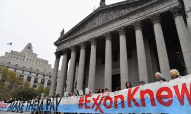 Climate activists on the first day of  ExxonMobil's trial outside the New York State Supreme Court building in October 2019. Exxon won the case