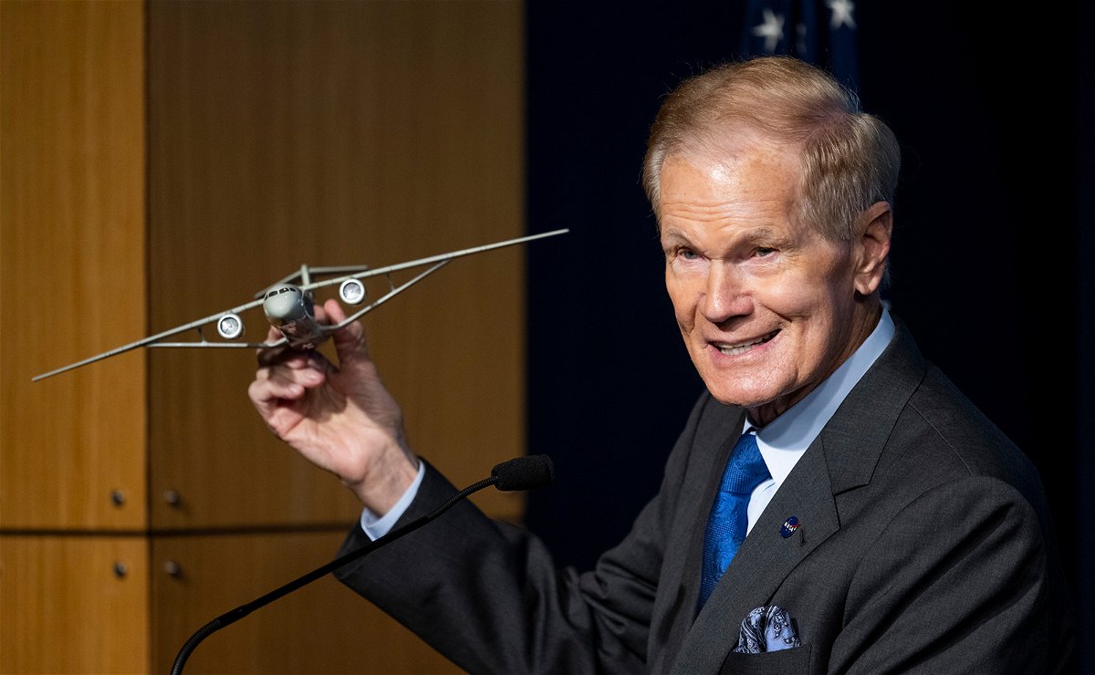 <i>Joel Kowsky/NASA</i><br/>NASA Administrator Bill Nelson holds a model of an aircraft with a Transonic Truss-Braced Wing.