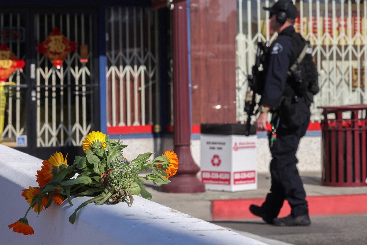 <i>Mike Blake/Reuters</i><br/>Flowers are seen near the location of a mass shooting that took place in Monterey Park