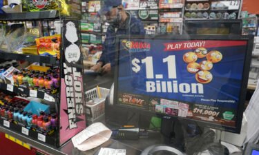 A convenience store in Pittsburgh advertises Tuesday's rare Mega Millions prize exceeding $1 billion.