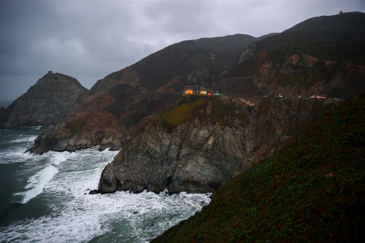 <i>Tayfun Coskun/Anadolu Agency/Getty Images</i><br/>Rescue teams are pictured here at the Pacific Coast Highway location where a Tesla plunged over a cliff on January 2.