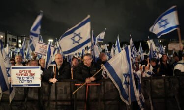 Israelis protest against the government's plans to overhaul the country's legal system in Tel Aviv on January 14.