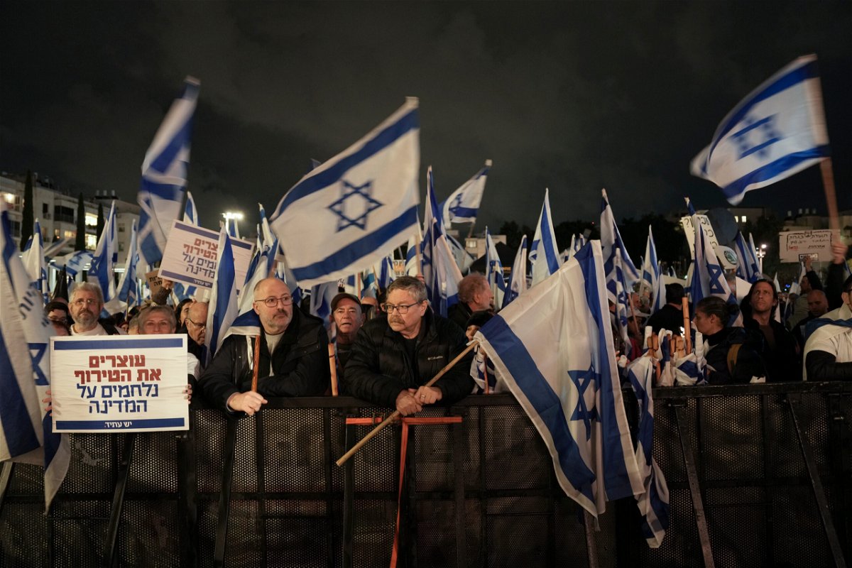 <i>Oded Balilty/AP</i><br/>Israelis protest against the government's plans to overhaul the country's legal system in Tel Aviv on January 14.