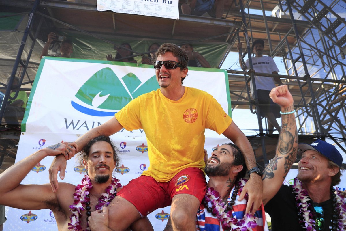 <i>Jamm Aquino/AP</i><br/>Luke Shepardson is congratulated by fellow surfers Landon McNamara (left) and Billy Kemper after winning the Eddie Aikau Big Wave Invitational at Waimea Bay.