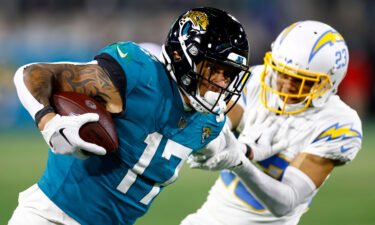 Evan Engram of the Jacksonville Jaguars carries the ball against the Los Angeles Chargers during the second half of the game in the AFC Wild Card playoff game on January 14.