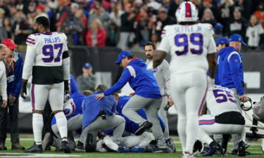Hamlin is examined after collapsing on the field in the first quarter of Monday night's game between the Buffalo Bills and Cincinnati Bengals.