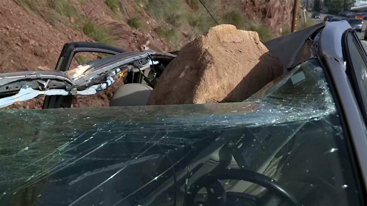 <i>KCBS/KCAL</i><br/>Mauricio Henao's car was crushed by a boulder on Tuesday in Malibu