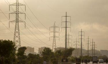 A nationwide power outage in Pakistan left nearly 220 million people without electricity on Monday. Pictured are powerlines High voltage in Karachi