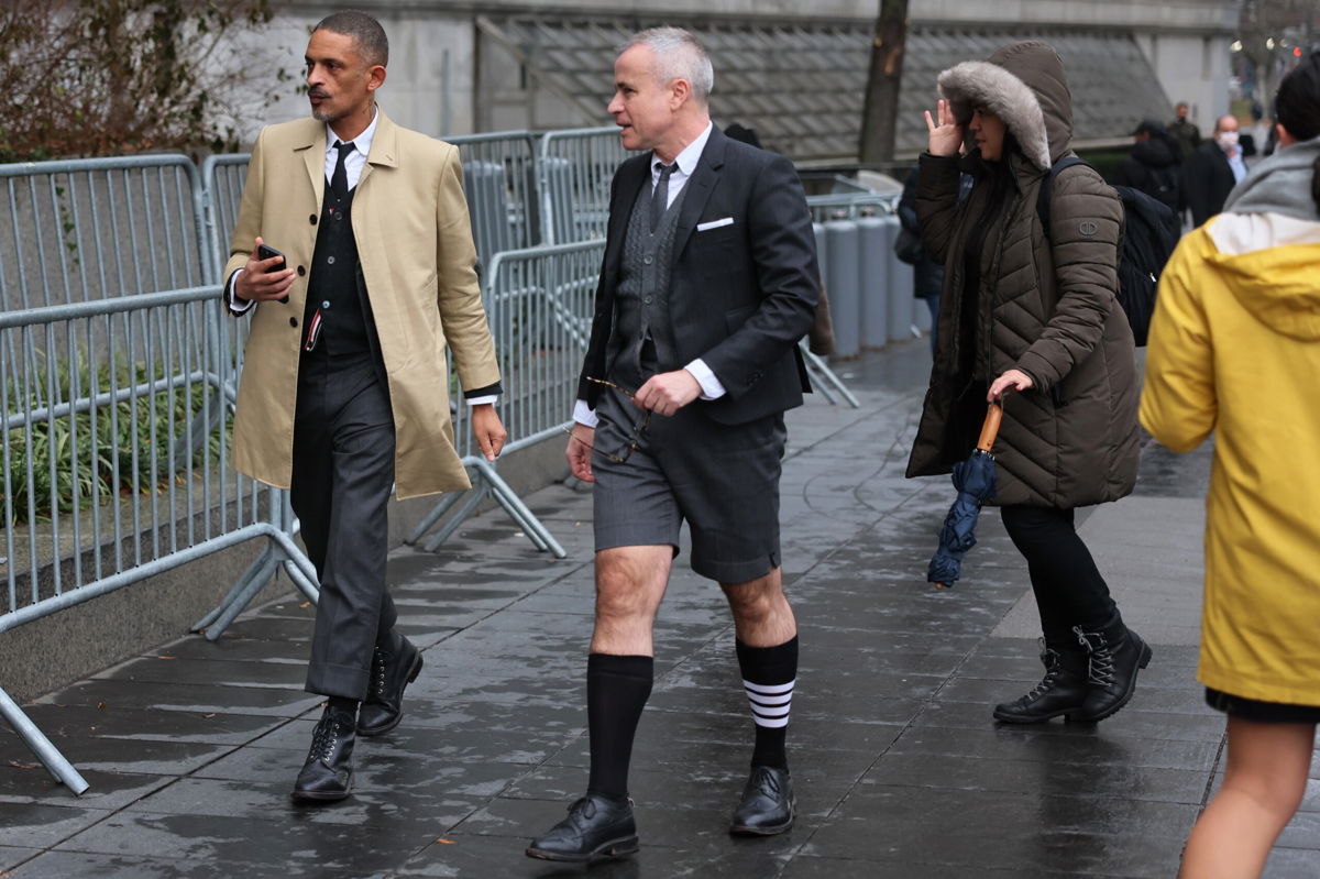 <i>Michael M. Santiago/Getty</i><br/>Fashion Designer Thom Browne arrives to court on January 3 wearing one of his brand's signature four-striped socks.