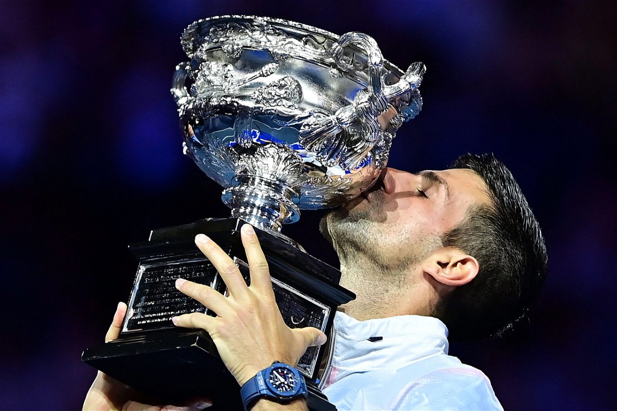 <i>Manan Vatsyayana/AFP/Getty Images</i><br/>Novak Djokovic celebrates with the Australian Open in Melbourne on January 29.