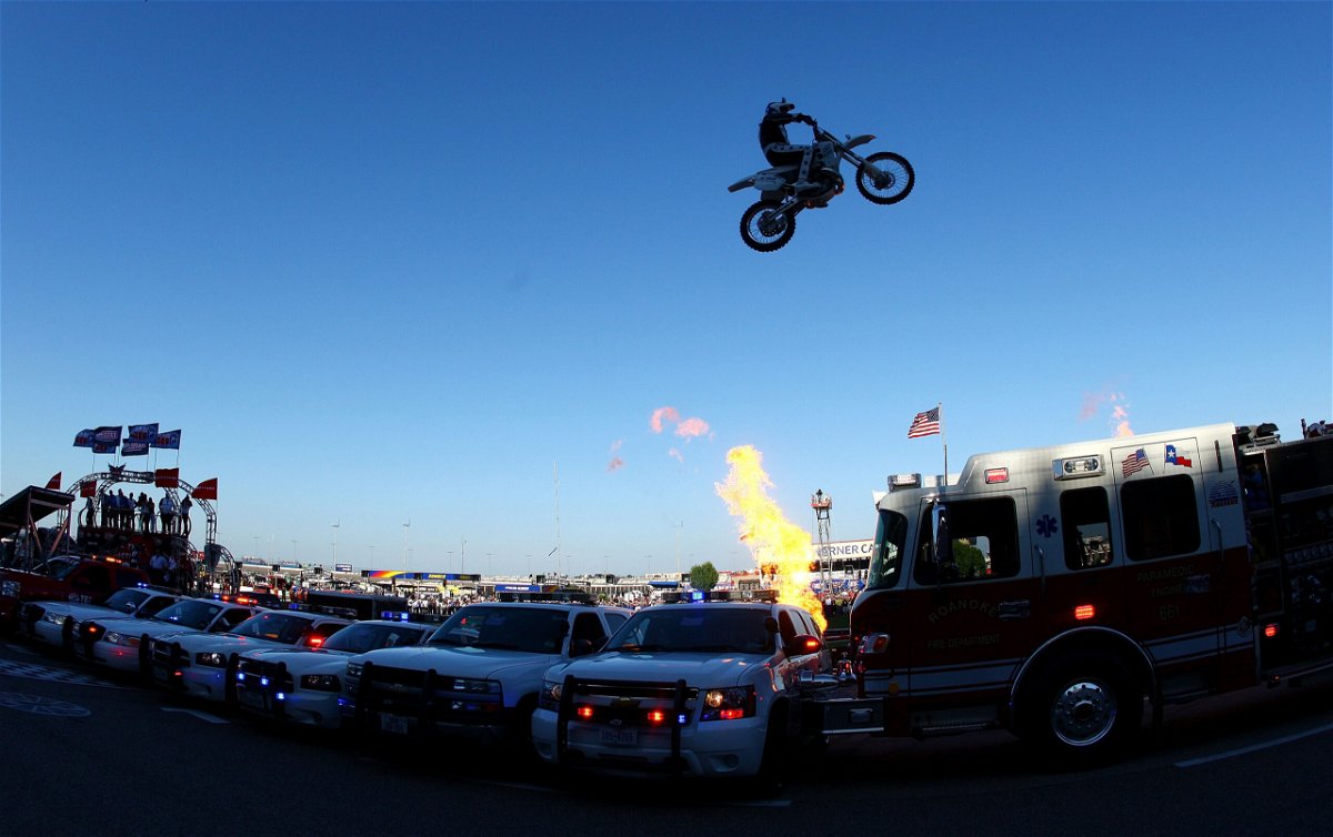 <i>Donald Miralle/Getty Images</i><br/>Motorcycle daredevil Robbie Knievel jumps a line of police cars